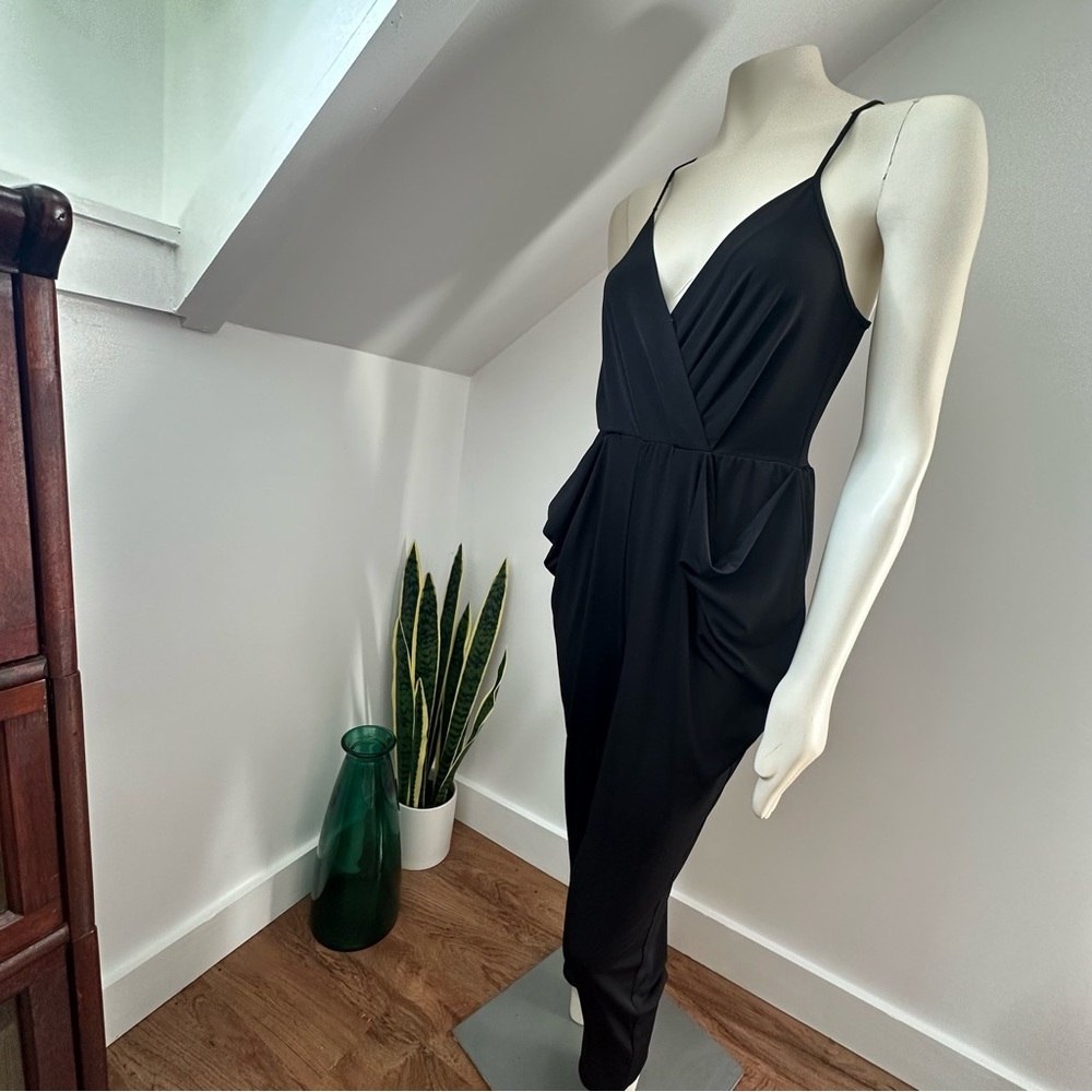 BCBGeneration : Strappy Black Jumpsuit with unique pocket detail & keyhole back
